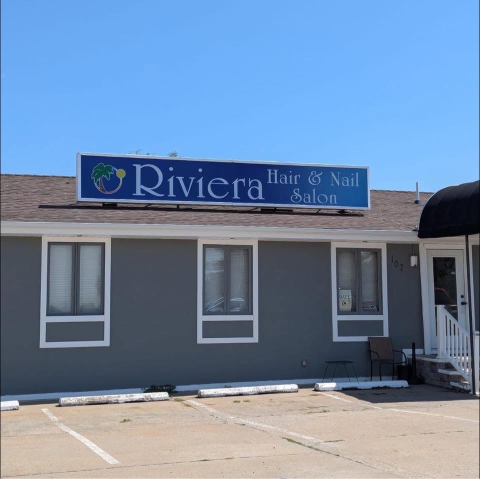 The Riviera Hair and Nail Salon storefront sign